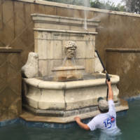 Powerwashing the pool fountain