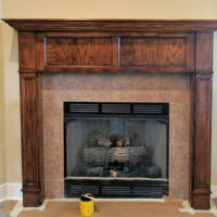 A refurbished and stained fireplace